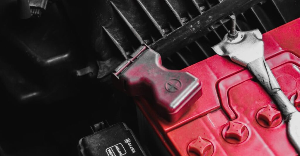 Detailed view of car battery and engine parts with wrench, focusing on repair and maintenance.
